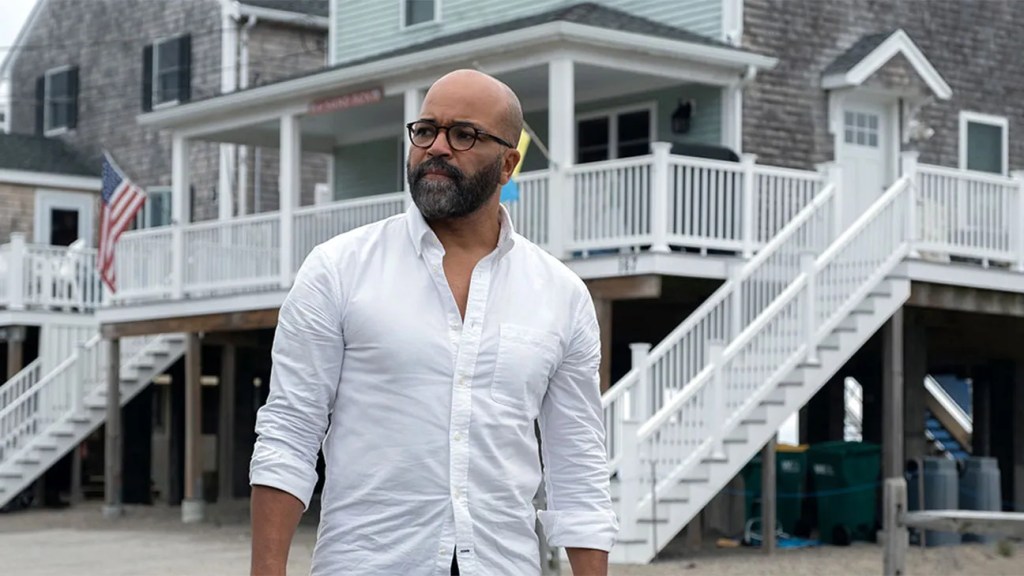 An image from the film American Fiction. It features a man (Jeffery Wright) standing in front of a large beach house.