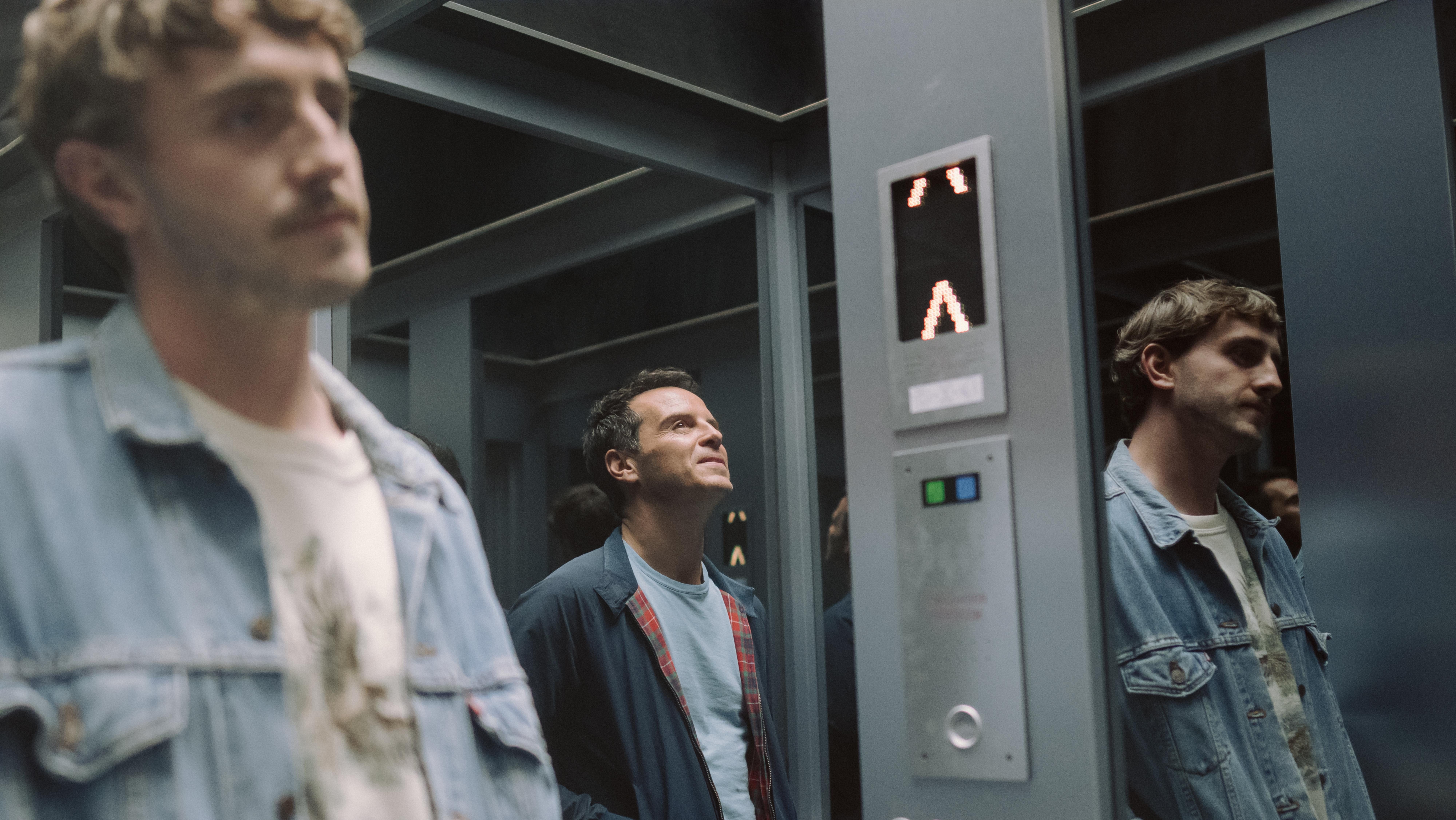An image from the film All of Us Strangers. It features two men (Paul Mescal and Andrew Scott) in a lift.