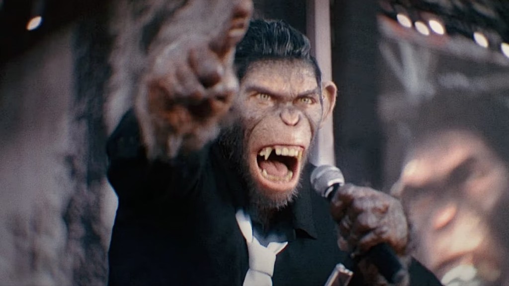 An image from the film Better Man. It features a monkey performing on stage.