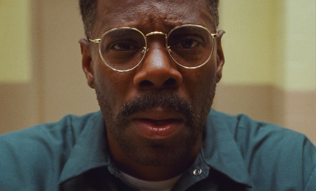 An image from the film Sing Sing. It features a close up of a man (Colman Domingo) in prison wearing glasses.