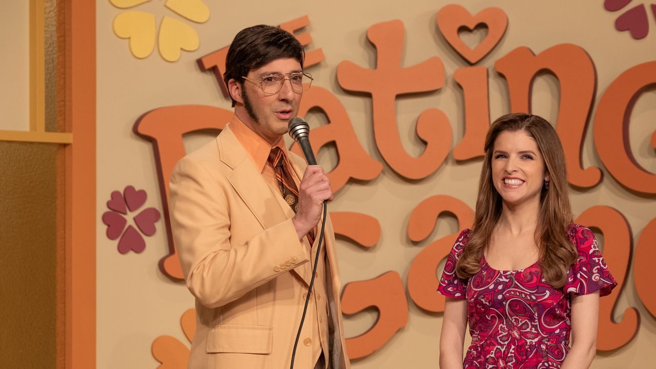 An image from the film Woman of the Hour. It features a man (Tony Hale) and a woman (Anna Kendrick) on the set of a TV dating show.